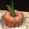 Delicious Lemon Bundt Cake with Lemon Glaze Topped with a sprig of Rosemary